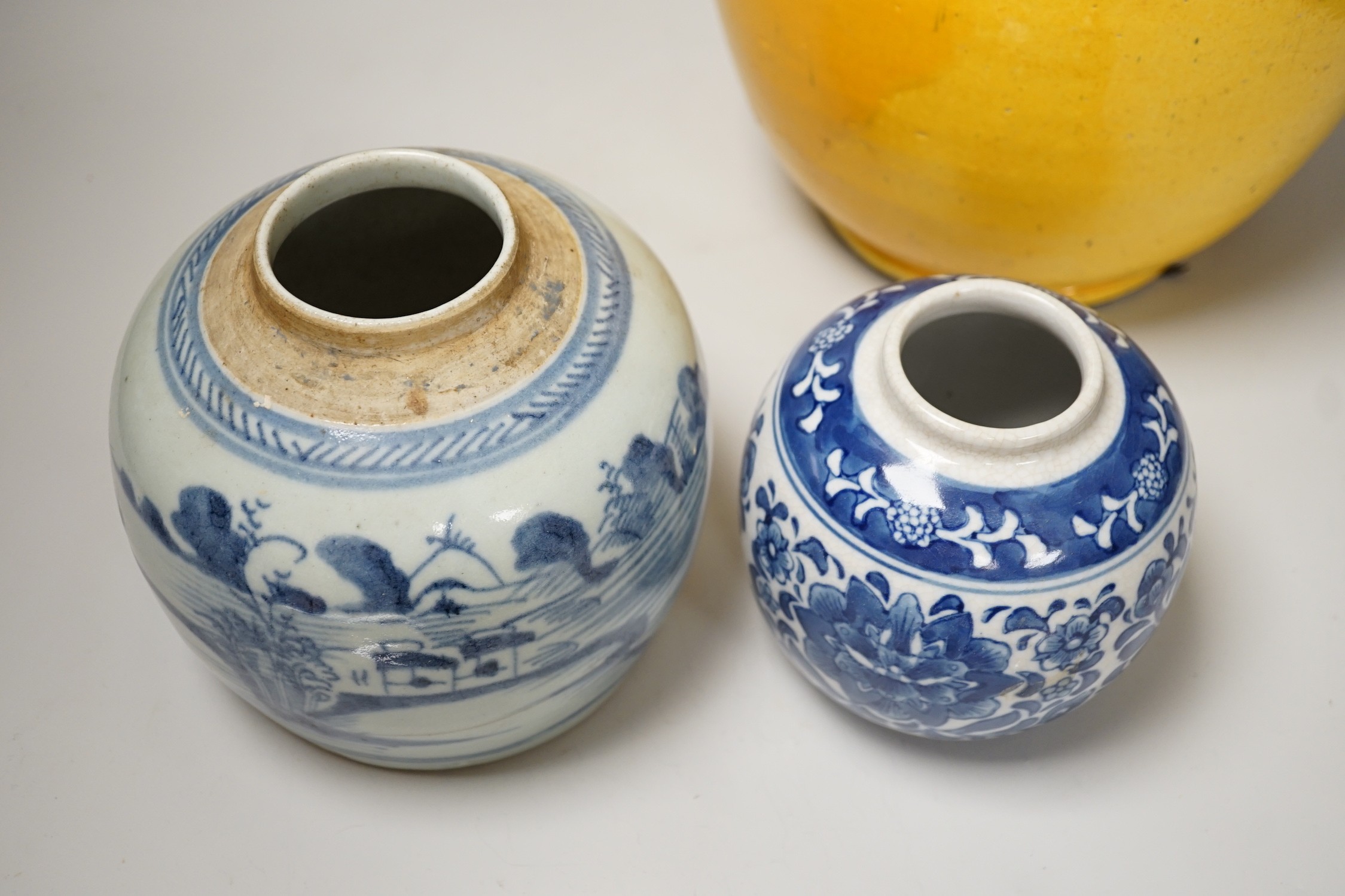 Two Chinese blue and white ginger jars, together with a large Chinese yellow glazed vase, tallest 31cm